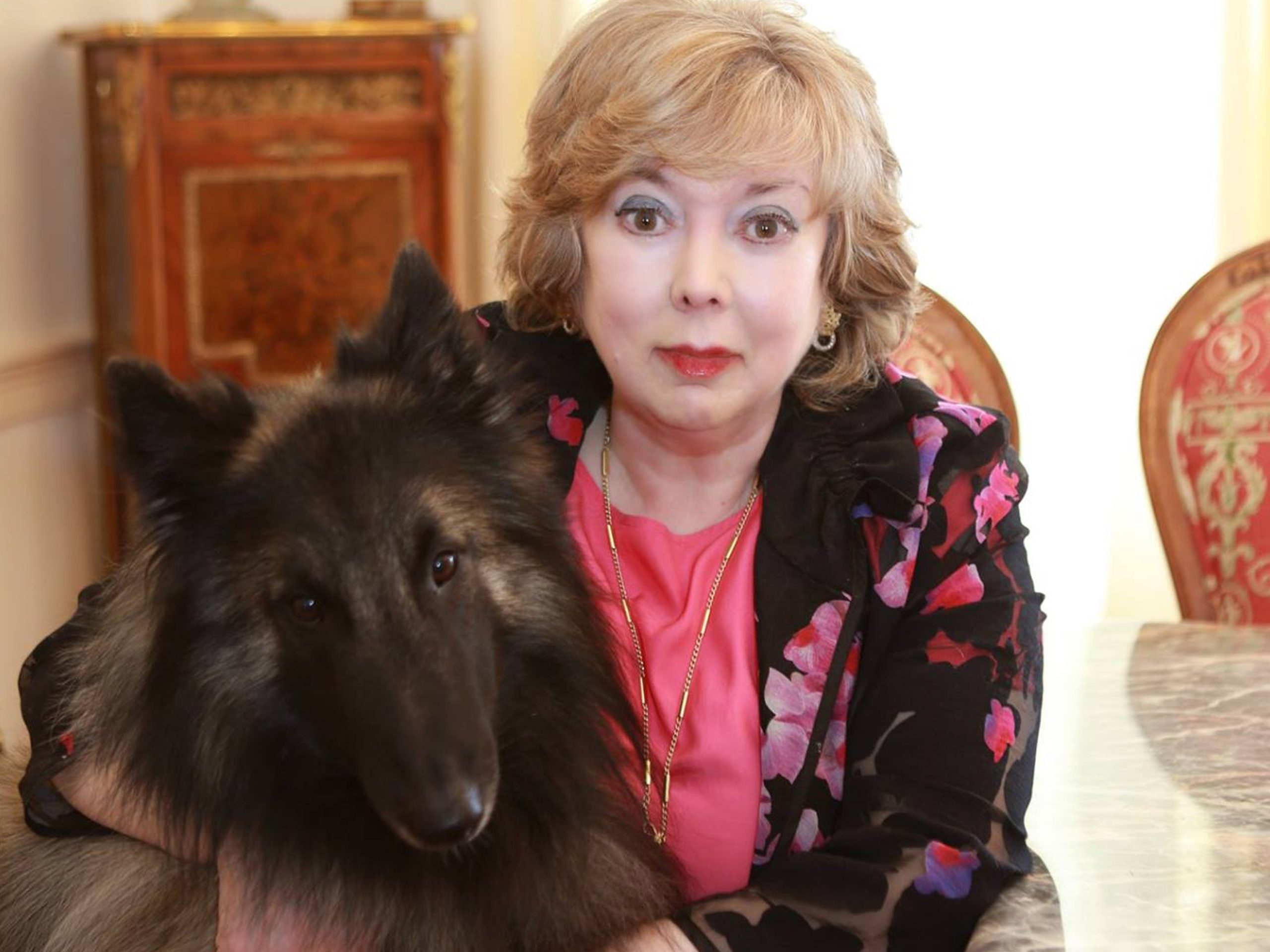 A picture of Arlene Kay and her dog